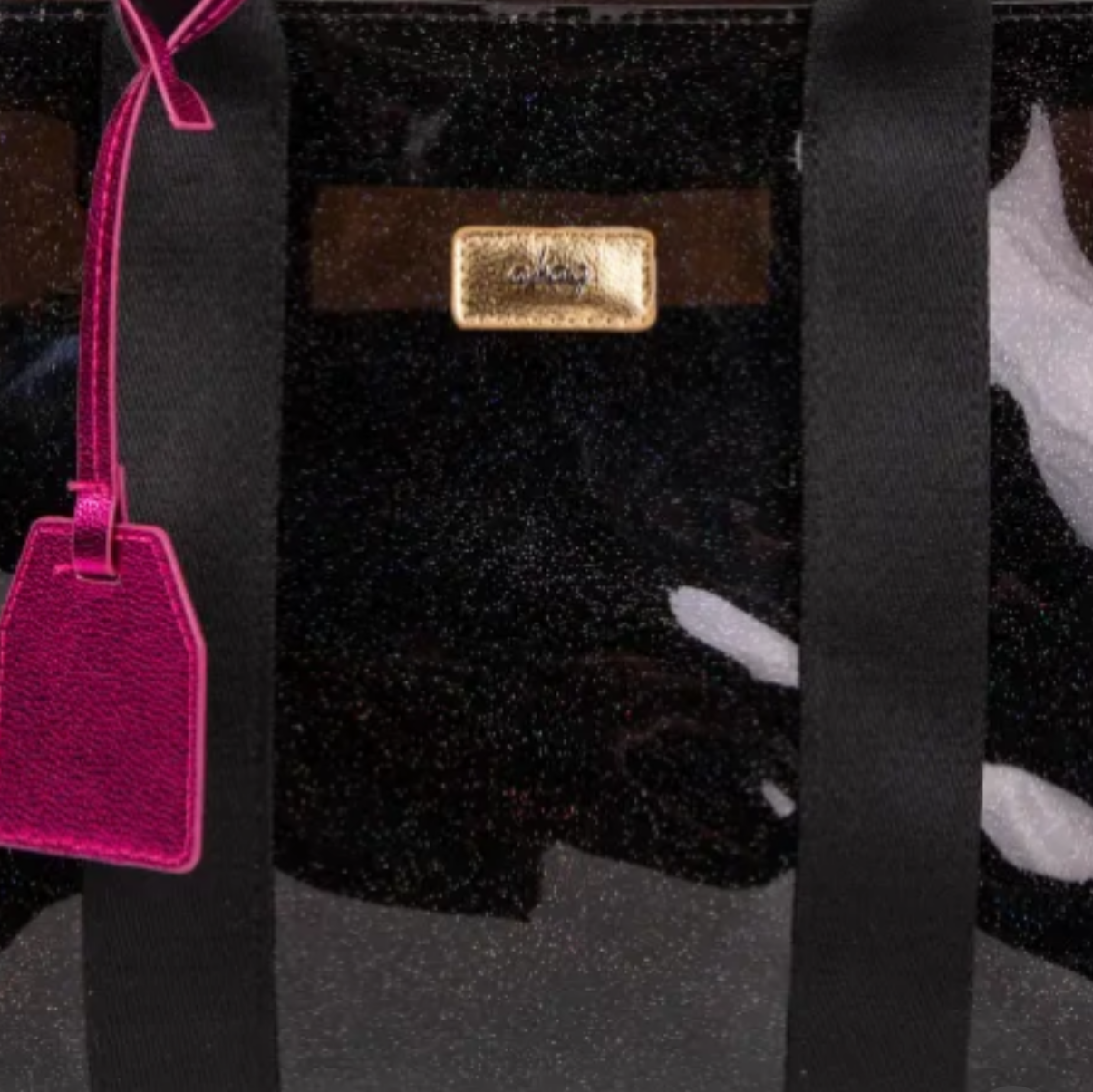 Bolso shopper transparente con brillo negro y detalles fucsia moderno.
