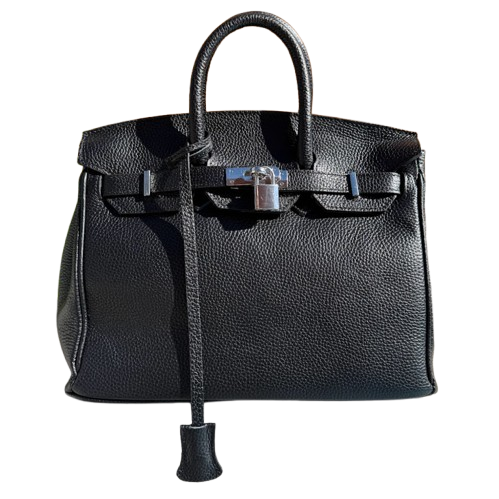 Bolso de piel de mano y cierre metálico.