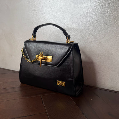 Mini bolso con detalle de cierre de cadena dorada + asa bandolera