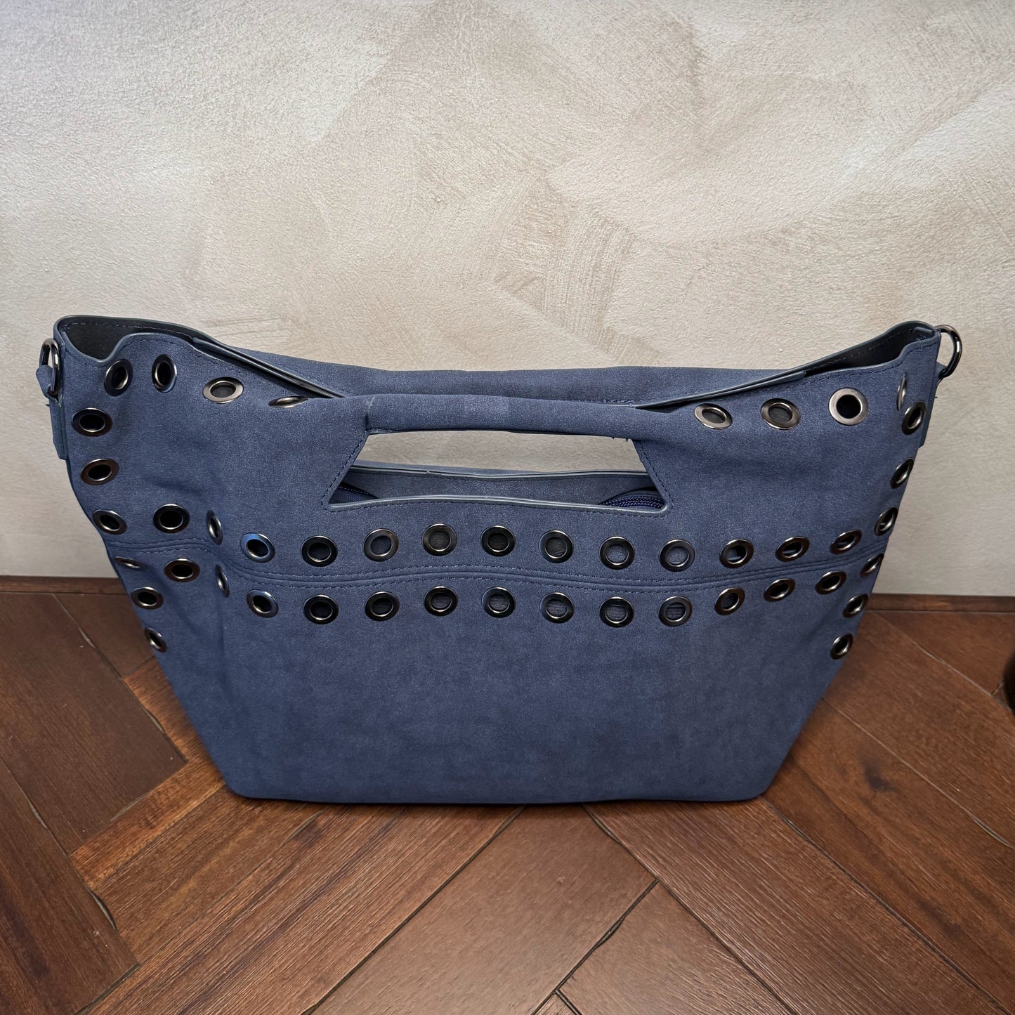 Bolso shopper con ojales metálicos